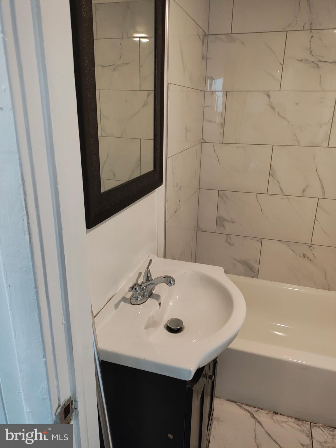 616 George Street Hagerstown, MD 21740 - Photo 14 of 16 a bathroom with a sink and a bathtub