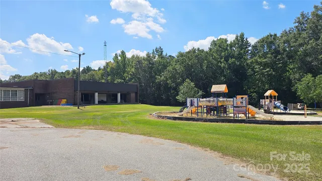 a view of a house with outdoor space and sitting area