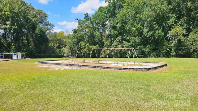 a view of a swimming pool with an outdoor space and seating area