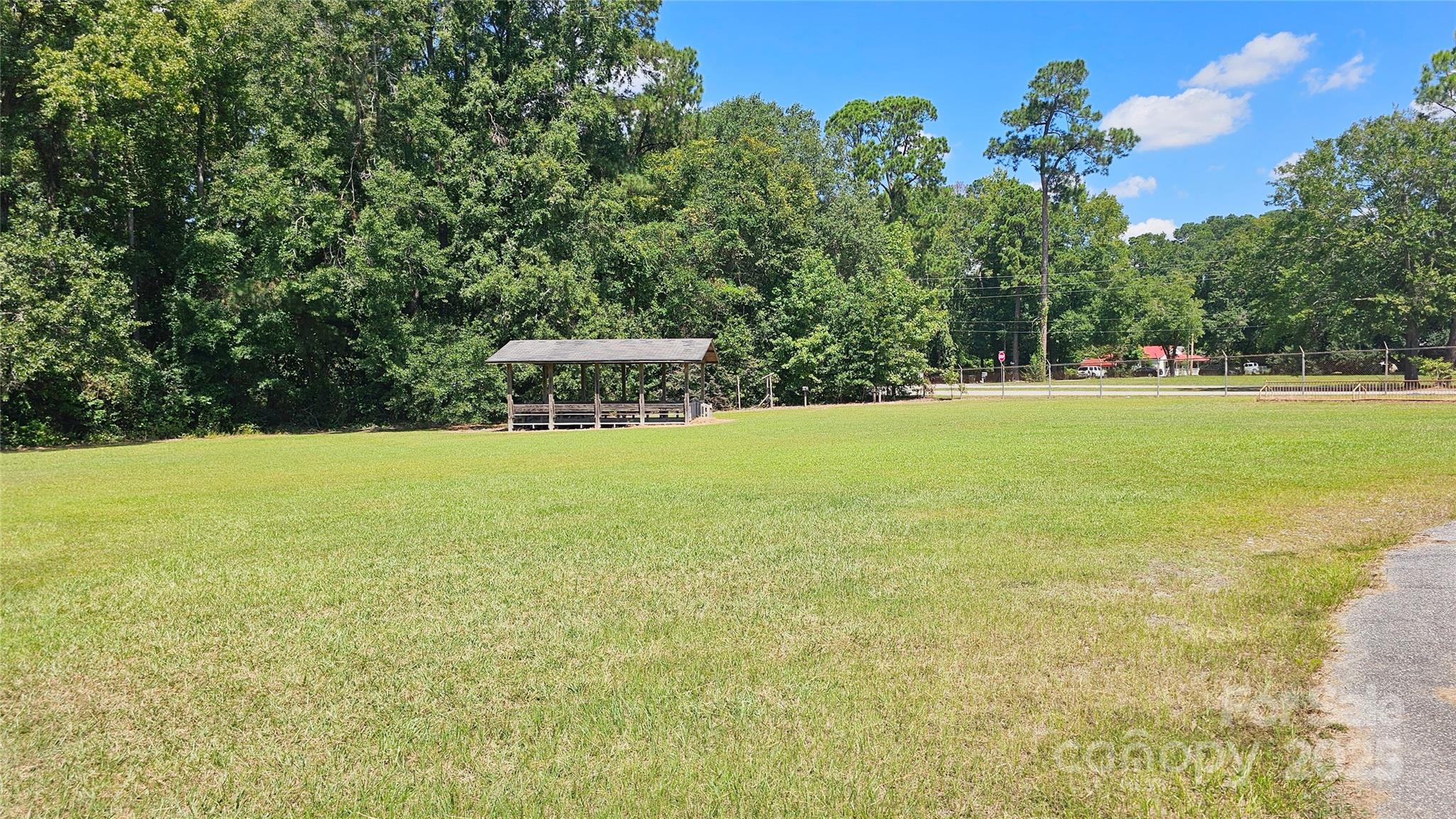 900 Patriot Street Dillon, SC 29536 - Photo 17 of 42 a view of a swimming pool with an outdoor space and seating area