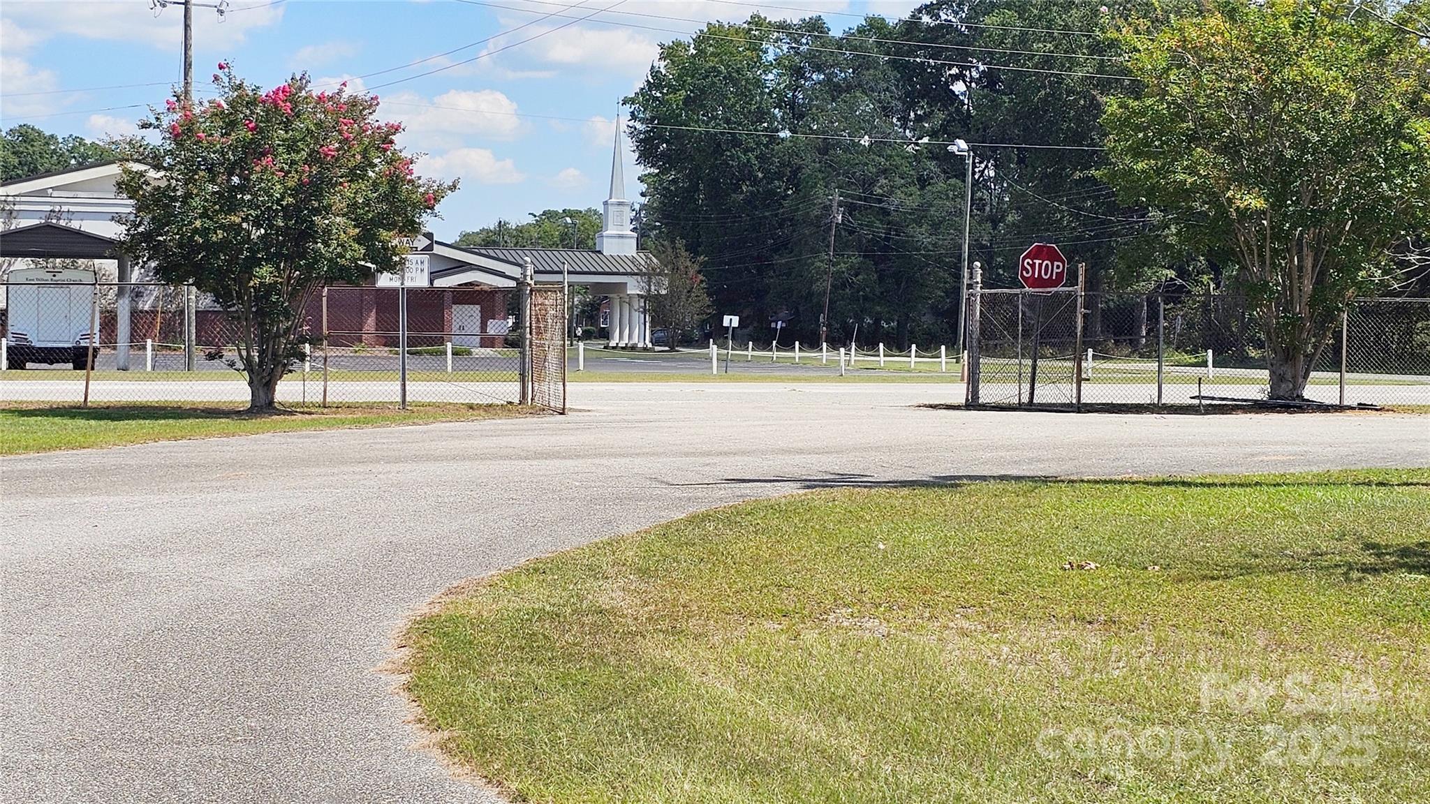 900 Patriot Street Dillon, SC 29536 - Photo 18 of 42 a view of a playground space and tree s