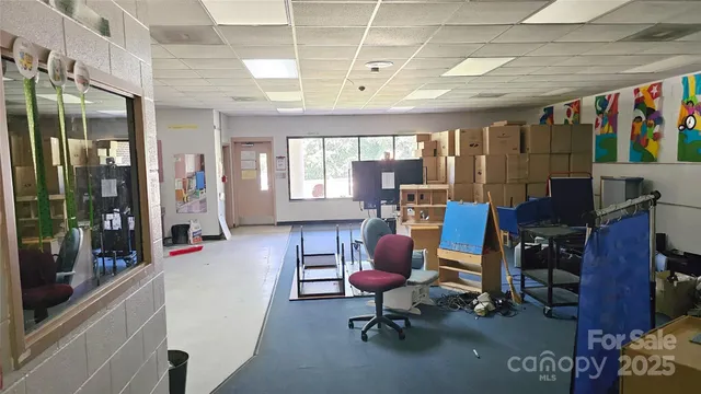 a view of a hallway with seating area