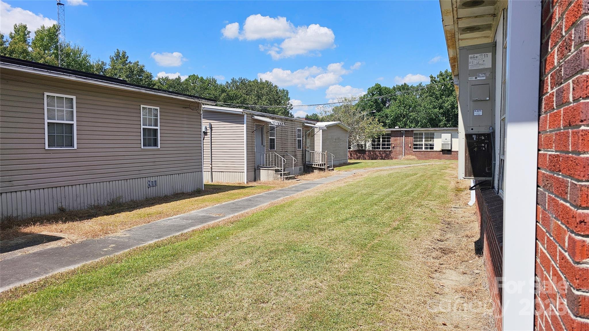 900 Patriot Street Dillon, SC 29536 - Photo 4 of 42 a backyard of a house with table and chairs