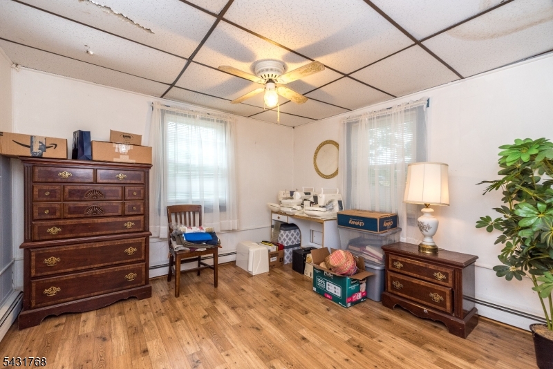 400 Mechlin Corner Road Pittstown, NJ 08867 - Photo 14 of 29 a living room with furniture and a fireplace