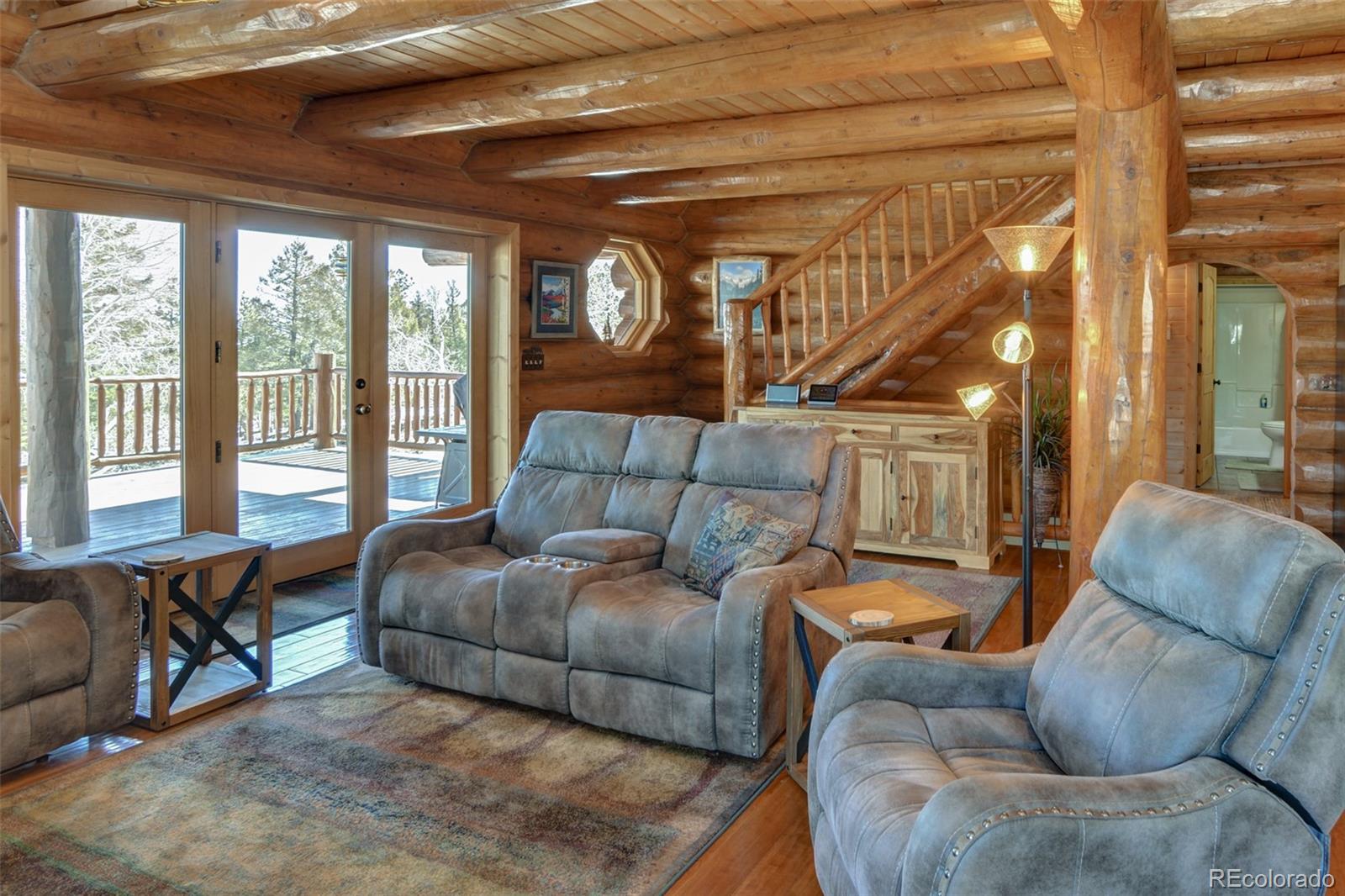 2120 Blacksmith Road Hartsel, CO 80449 - Photo 17 of 50 a living room with furniture and a large window