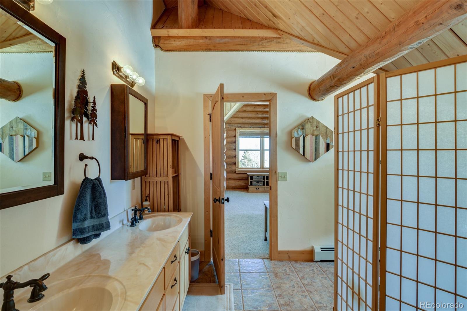 2120 Blacksmith Road Hartsel, CO 80449 - Photo 36 of 50 a bathroom with a sink and mirror