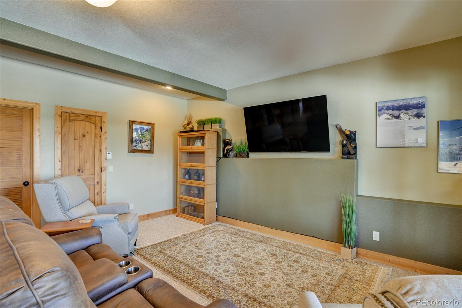 2120 Blacksmith Road Hartsel, CO 80449 - Photo 40 of 50 a living room with furniture and a flat screen tv