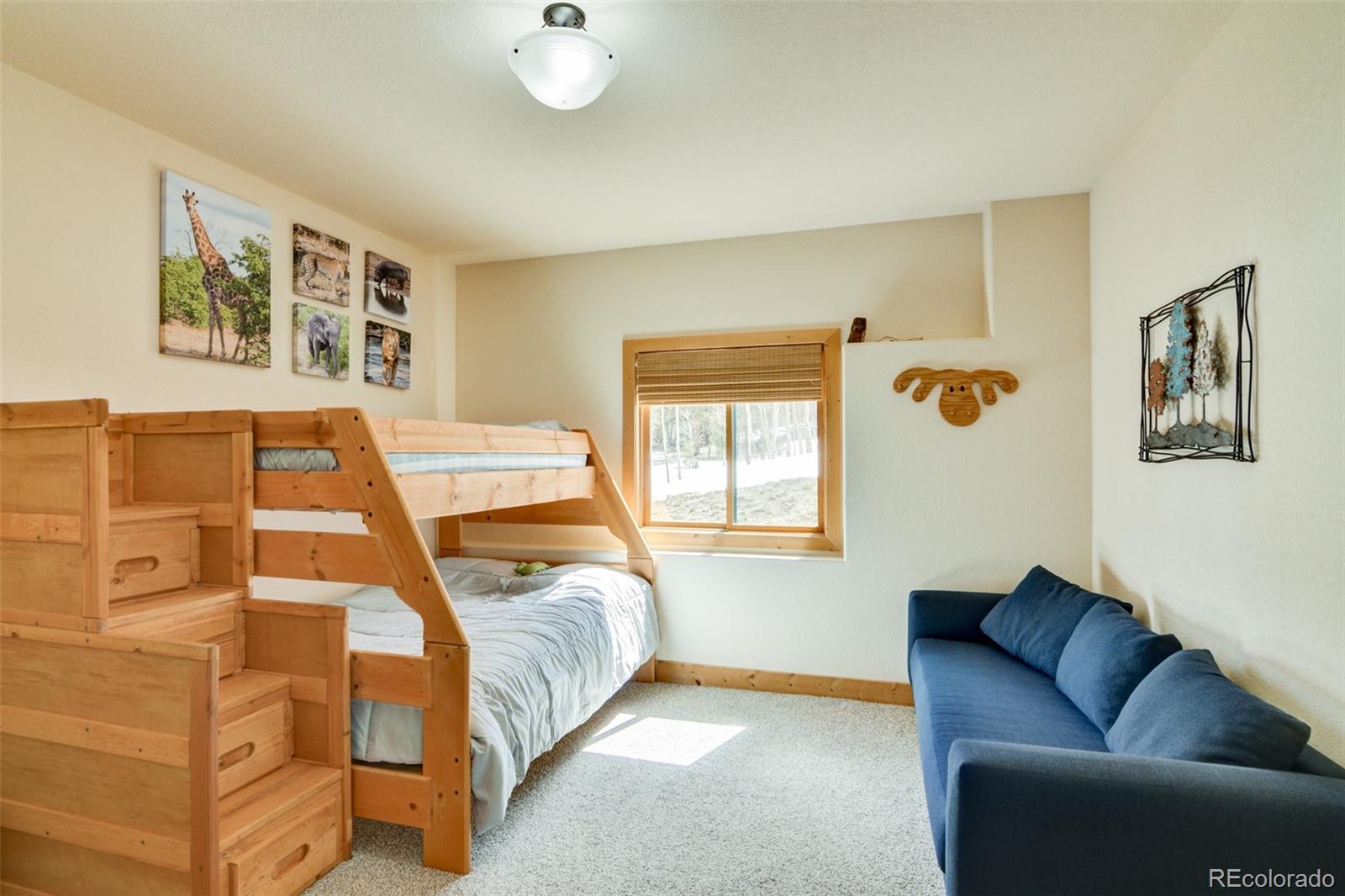 2120 Blacksmith Road Hartsel, CO 80449 - Photo 44 of 50 a bedroom with a bed couch and window