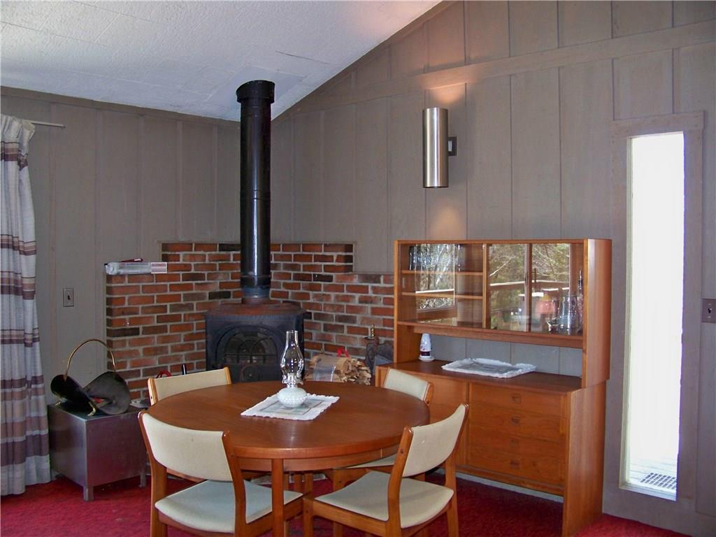 2011 Fox Hollow Road Carrabassett Valley, ME 04947 - Photo 4 of 16 Dining by the woodstove, and lots of...