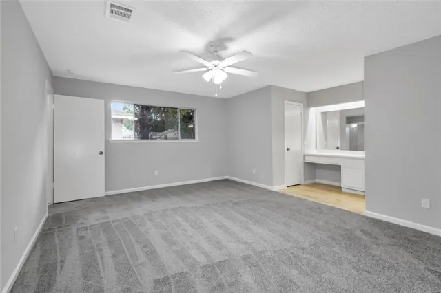 a view of an empty room with a window