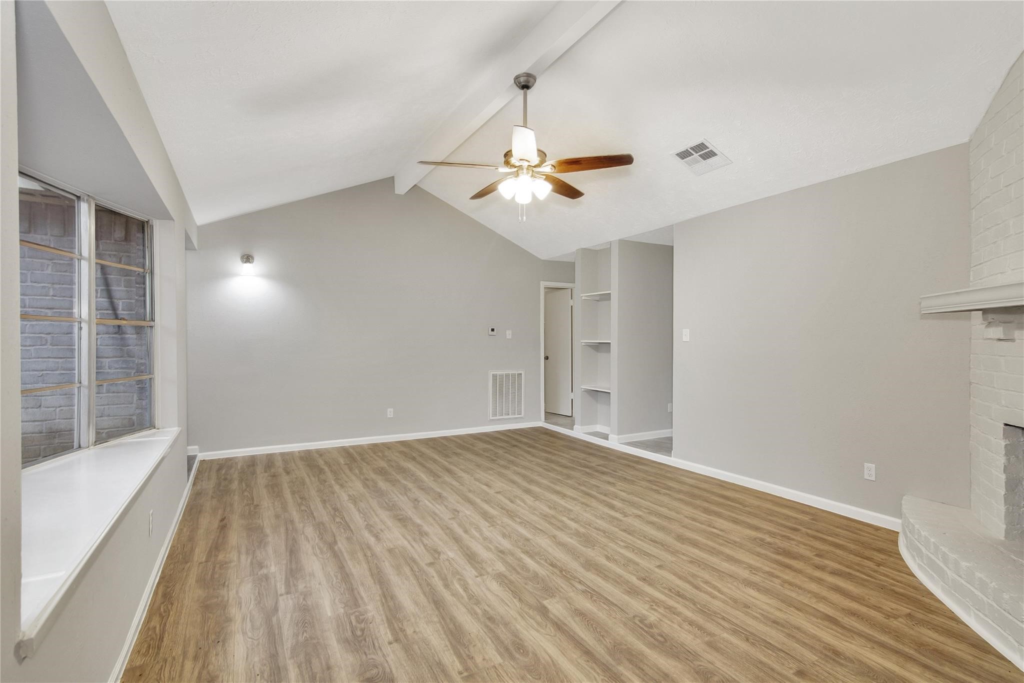 13703 Cologne Drive Houston, TX 77065 - Photo 15 of 32 a view of empty room with wooden floor and fan