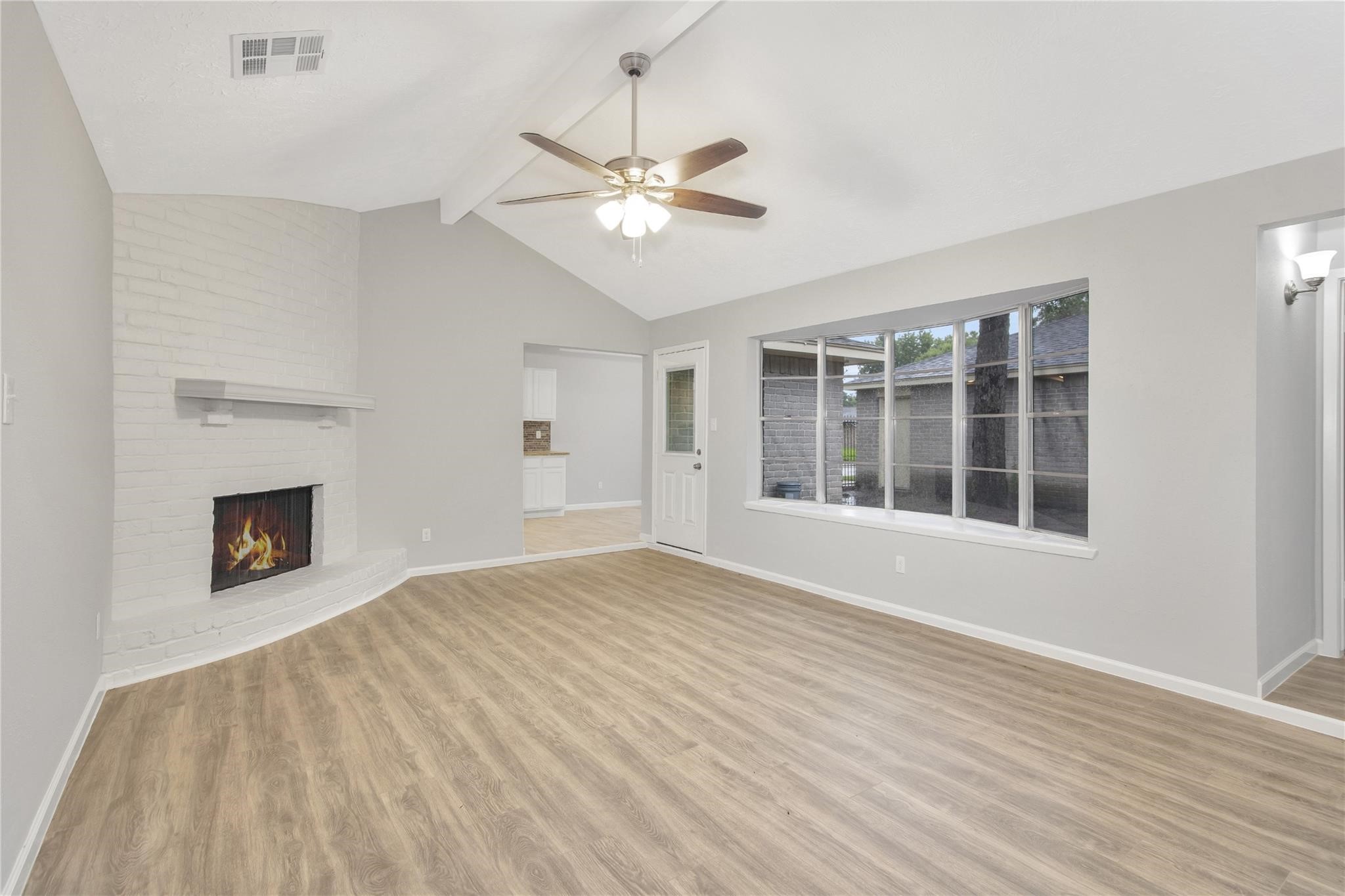13703 Cologne Drive Houston, TX 77065 - Photo 16 of 32 a view of an empty room with wooden floor and a window
