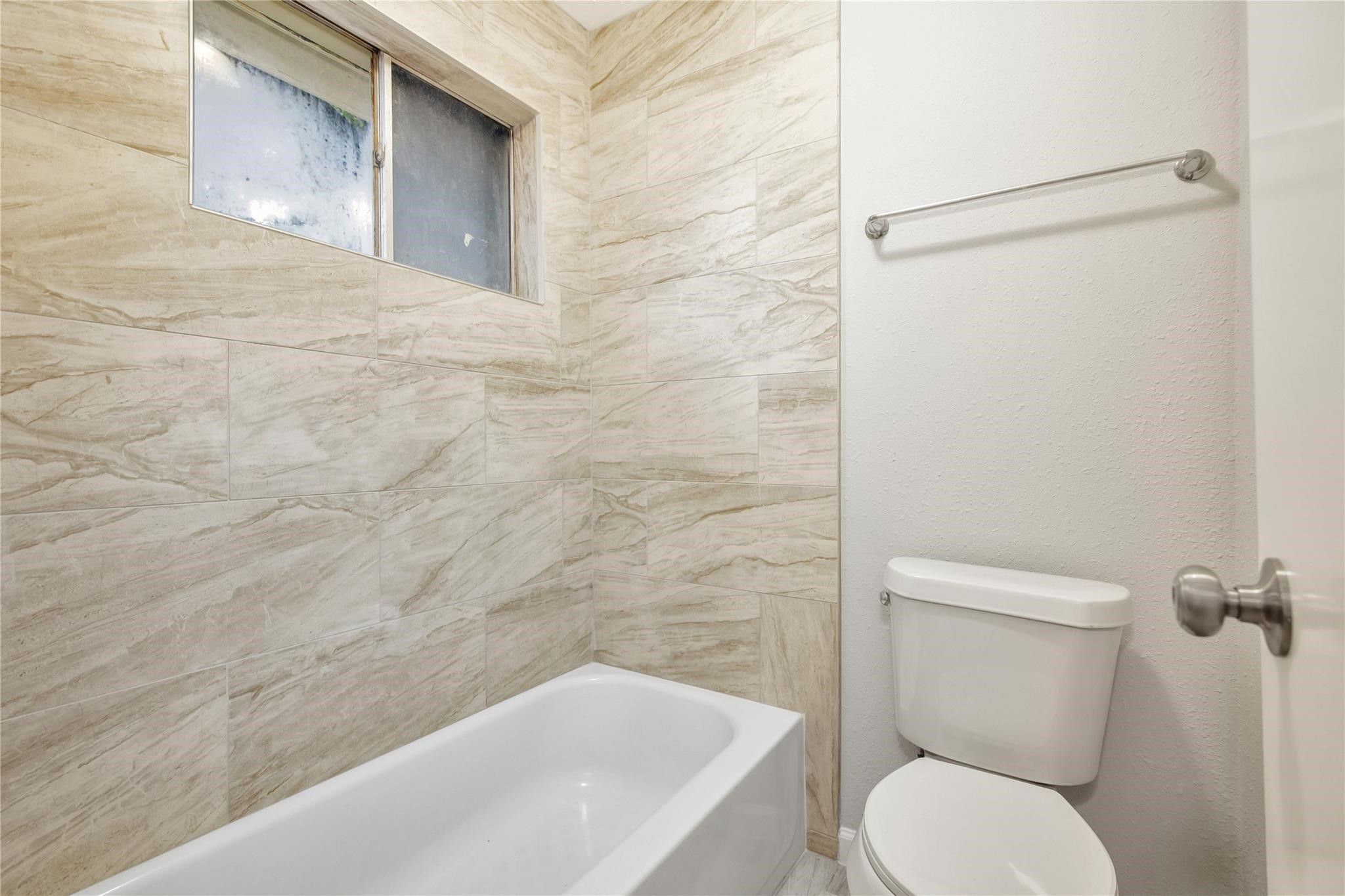 13703 Cologne Drive Houston, TX 77065 - Photo 25 of 32 a bathroom with a toilet and a shower