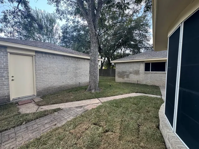 a view of a back yard of the house