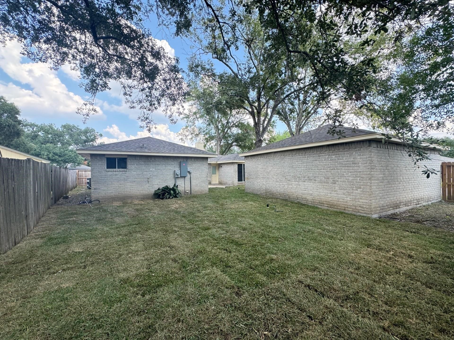 13703 Cologne Drive Houston, TX 77065 - Photo 32 of 32 a view of a house with a backyard