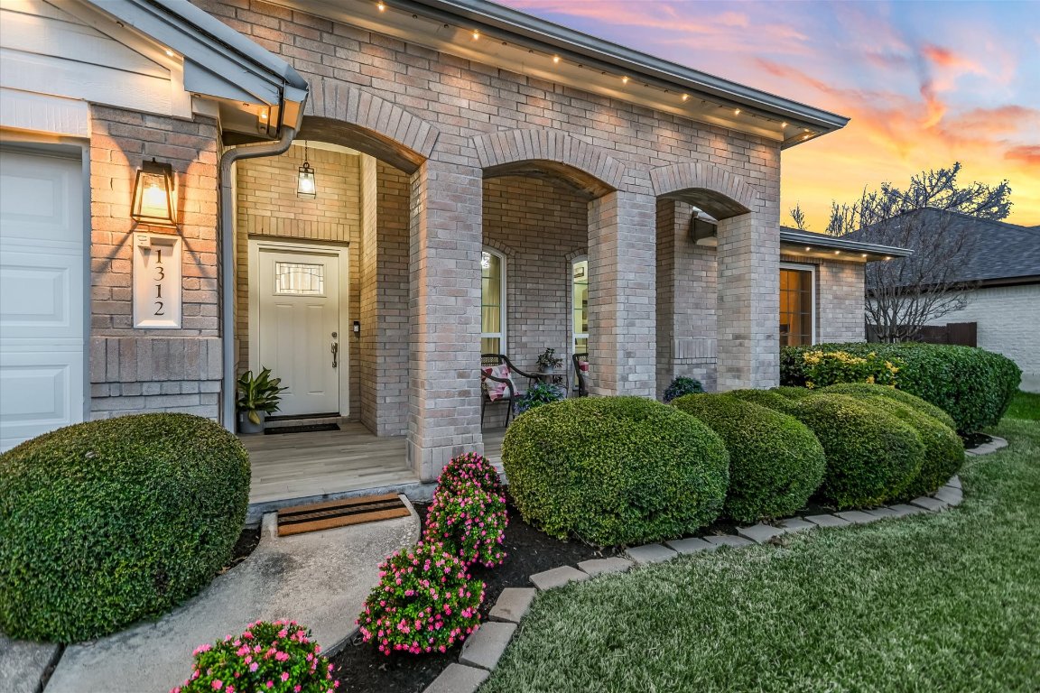 1312 Pigeon View Street Round Rock, TX 78665 - Photo 2 of 30 a front view of a house with a garden