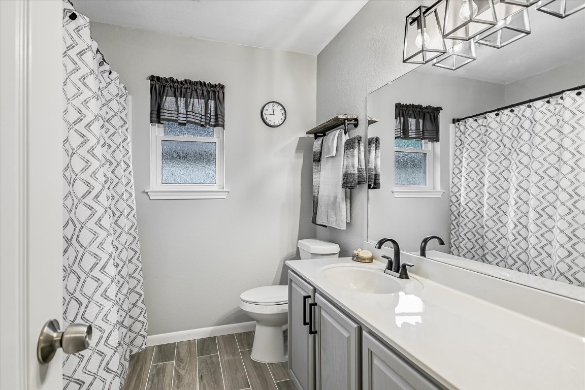 1312 Pigeon View Street Round Rock, TX 78665 - Photo 23 of 30 a bathroom with a sink toilet and shower