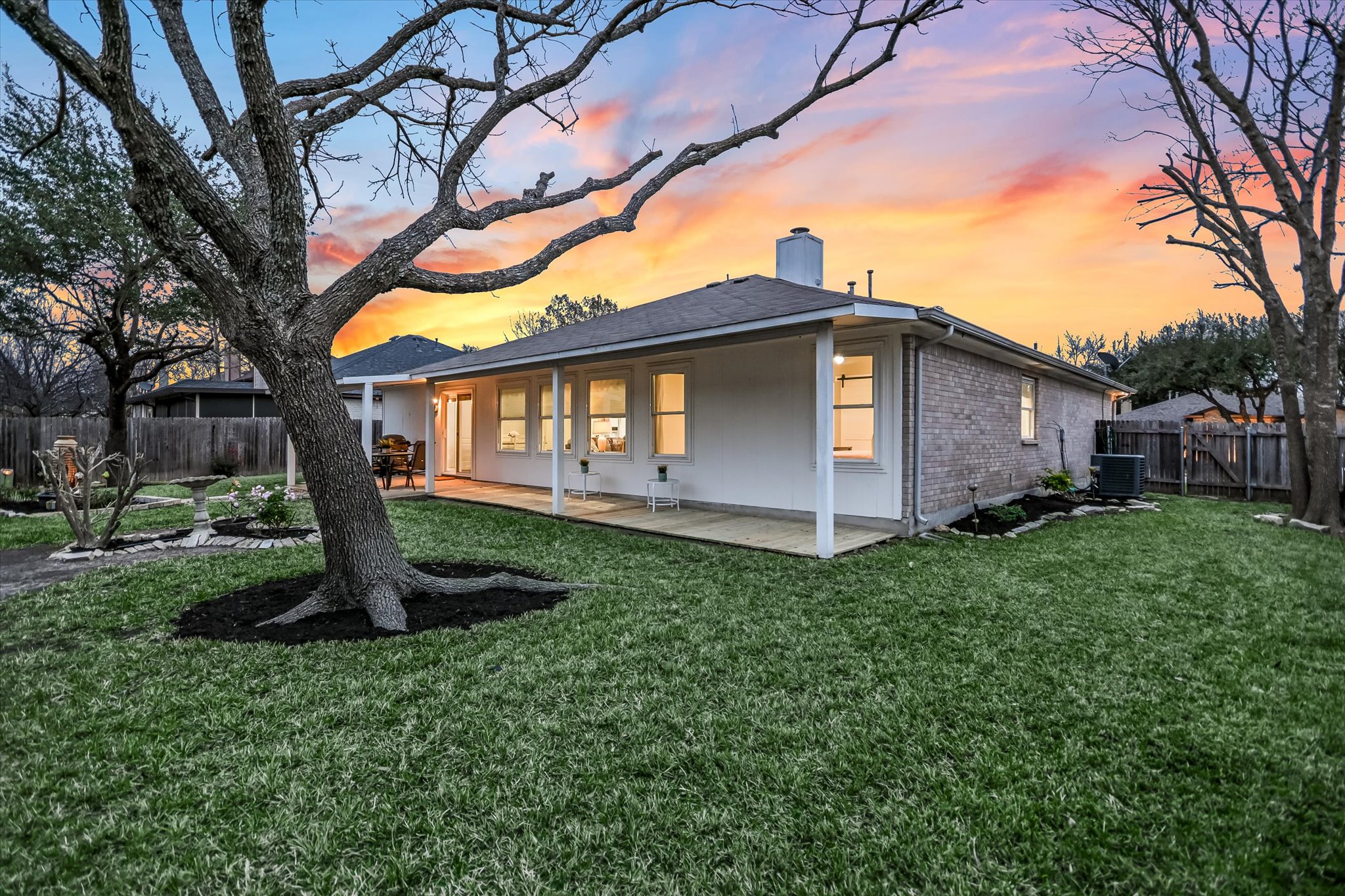 1312 Pigeon View Street Round Rock, TX 78665 - Photo 28 of 30 Back of house featuring a fenced backyard, brick siding, a chimney, and a patio
