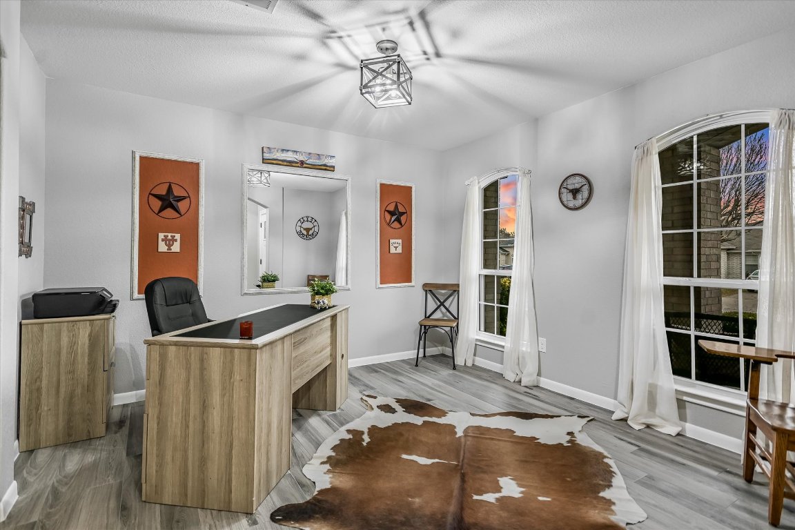 1312 Pigeon View Street Round Rock, TX 78665 - Photo 4 of 30 a workspace with furniture and window