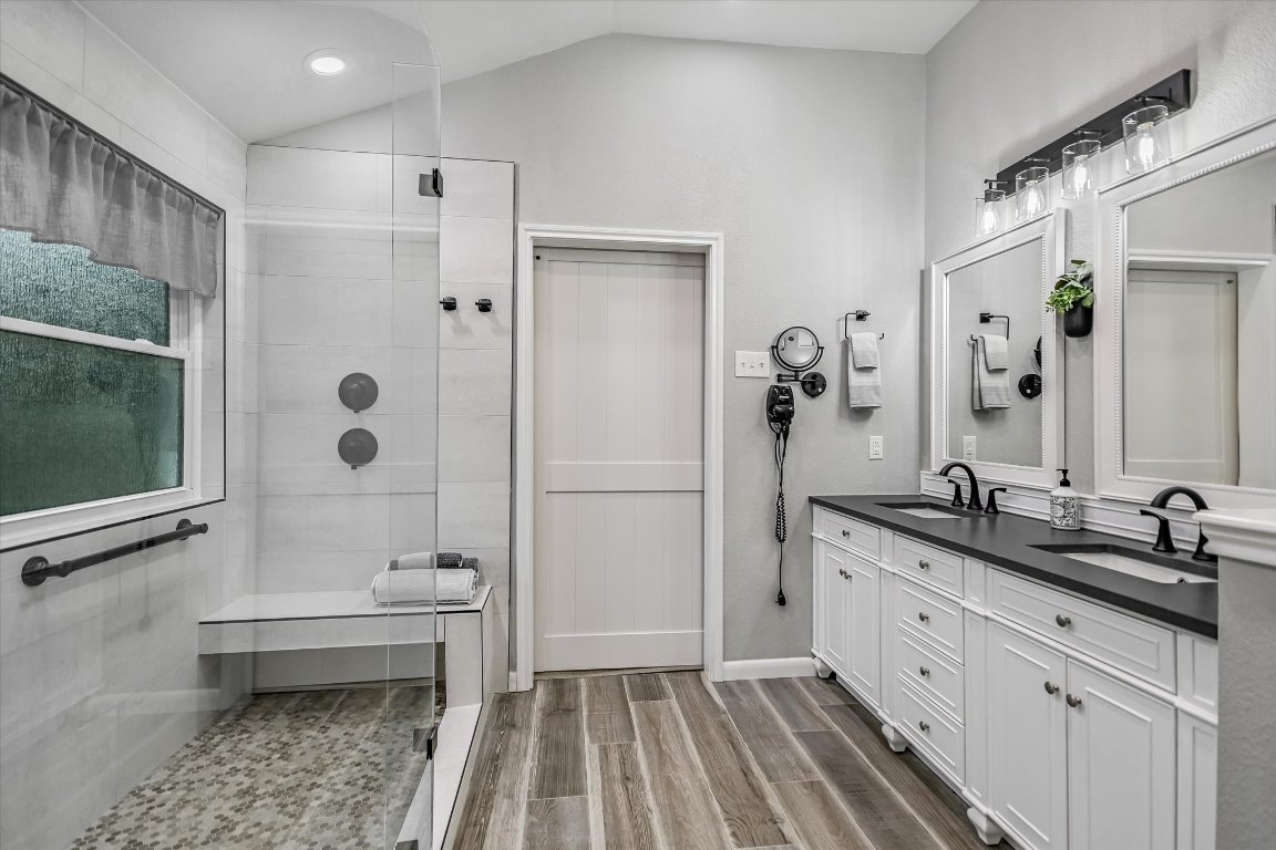 1312 Pigeon View Street Round Rock, TX 78665 - Photo 7 of 30 a bathroom with a granite countertop sink toilet and shower