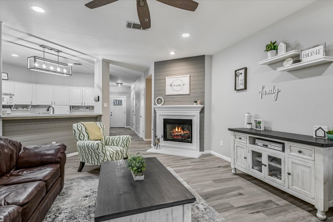 1312 Pigeon View Street Round Rock, TX 78665 - Photo 10 of 30 a living room with furniture and a fireplace