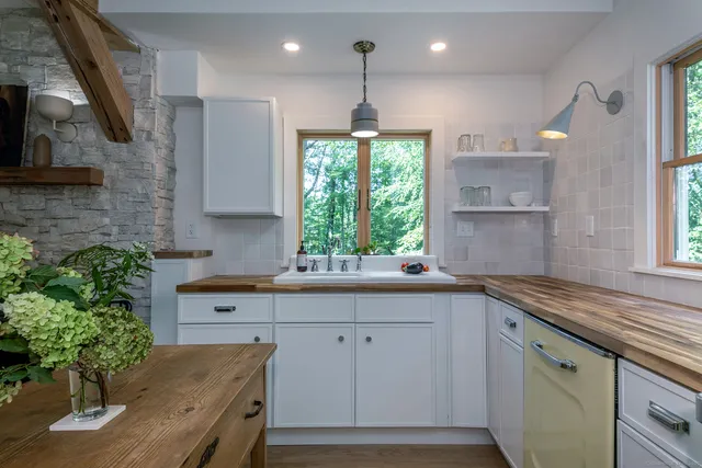 a kitchen with a sink and cabinets