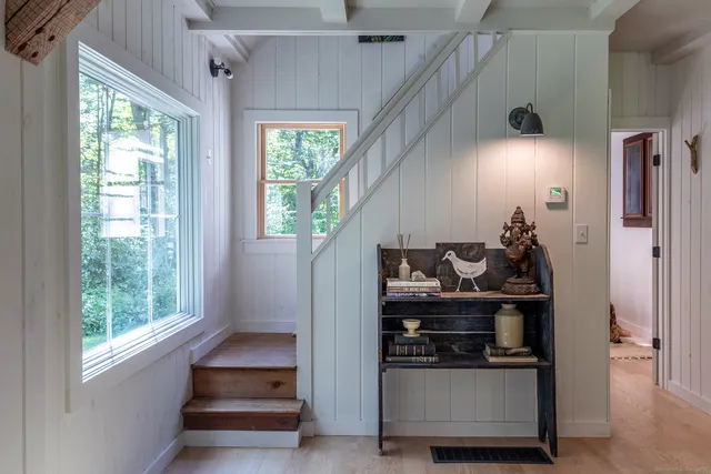 a bedroom with a bed and a lamp