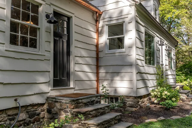 a living room with fireplace furniture and a wooden floor