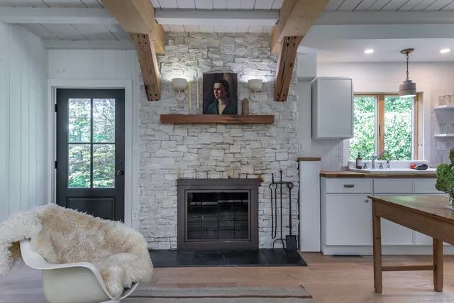 a kitchen with a stove and a wooden floors