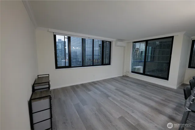 wooden floor in an empty room with a window