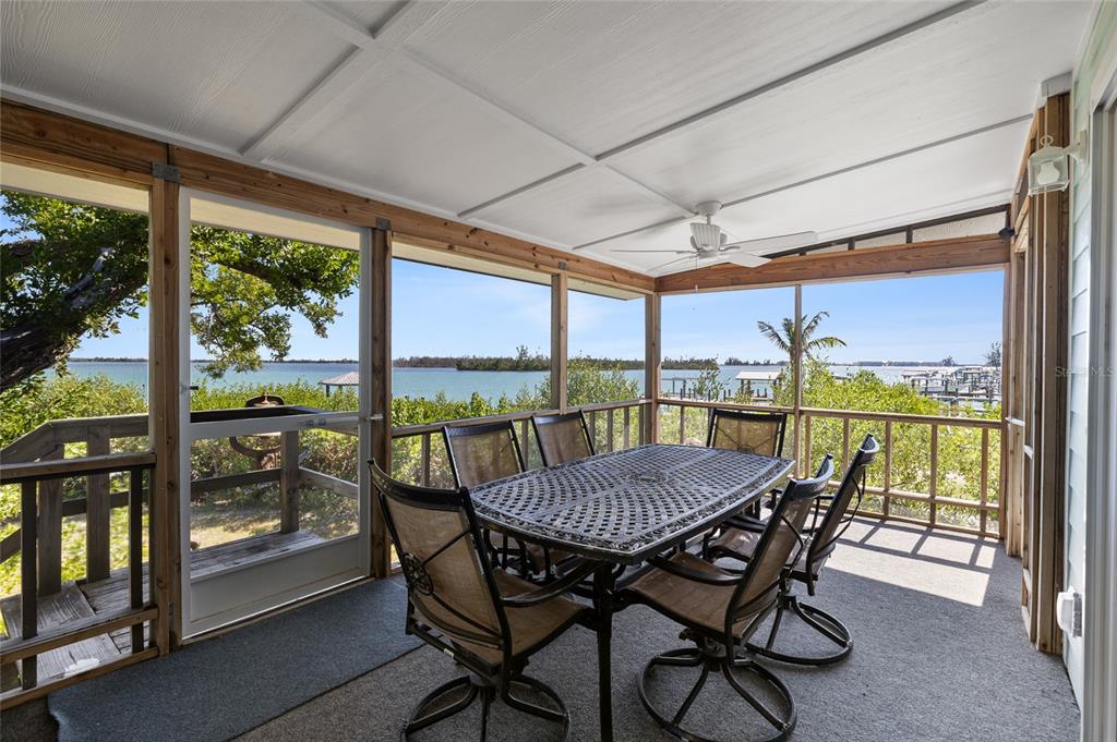 9776 Little Gasparilla Boca Grande, FL 33921 - Photo 12 of 52 a view of a dining room with furniture window and outside view