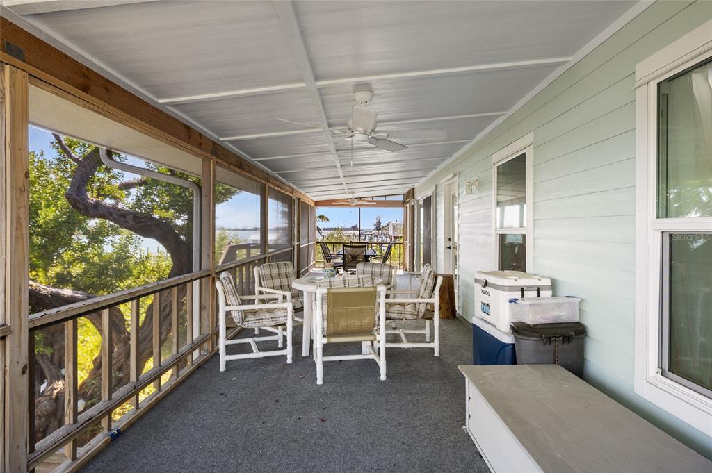 9776 Little Gasparilla Boca Grande, FL 33921 - Photo 13 of 52 a view of a dining room with furniture window and outside view