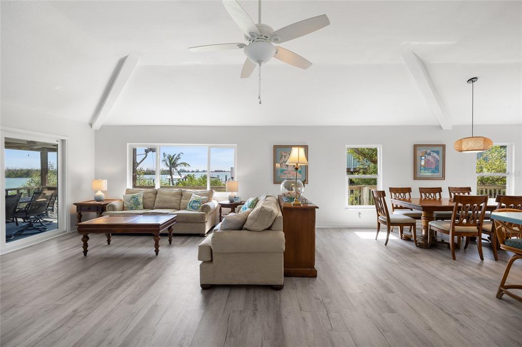 9776 Little Gasparilla Boca Grande, FL 33921 - Photo 16 of 52 a living room with furniture dining table and wooden floor