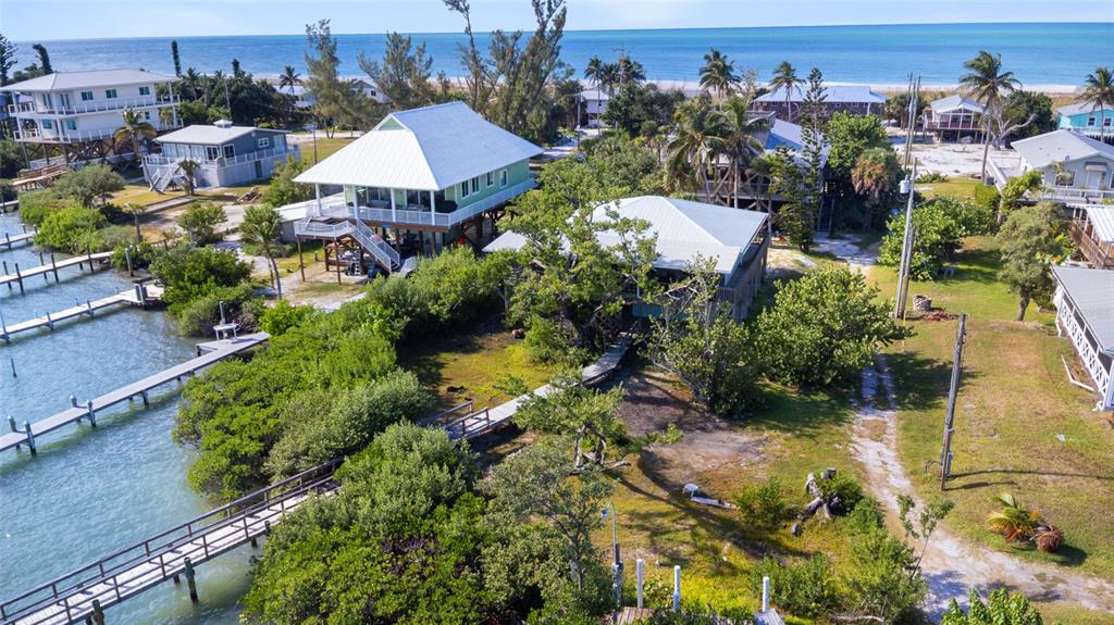 9776 Little Gasparilla Boca Grande, FL 33921 - Photo 2 of 52 an aerial view of multiple house