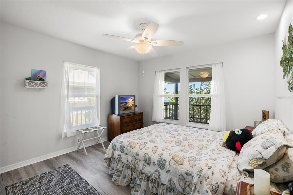 9776 Little Gasparilla Boca Grande, FL 33921 - Photo 23 of 52 a bedroom with a bed and a window