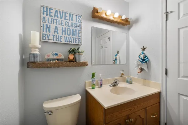 a bathroom with a sink a vanity and a mirror