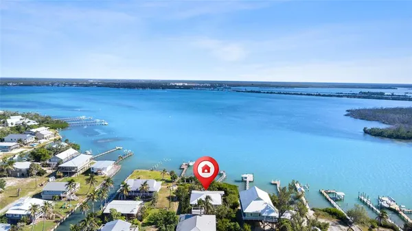 a view of a large body of water with a building in the background