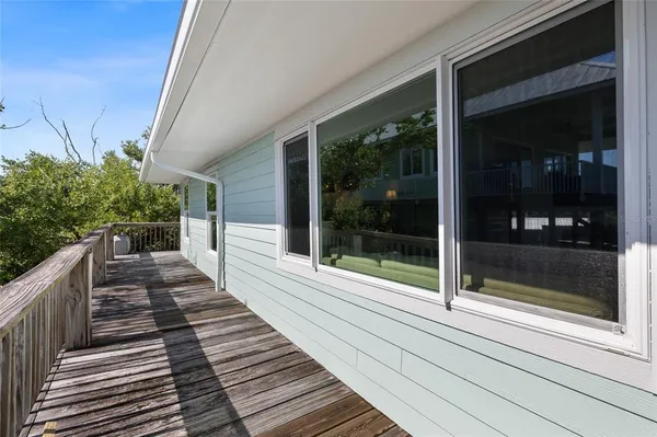a view of a patio with wooden floor