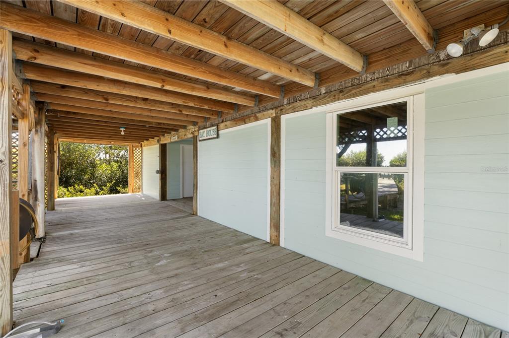 9776 Little Gasparilla Boca Grande, FL 33921 - Photo 39 of 52 a view of empty room with wooden floor and fan