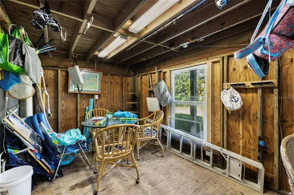 a room with furniture pool table table tennis table and a chandelier