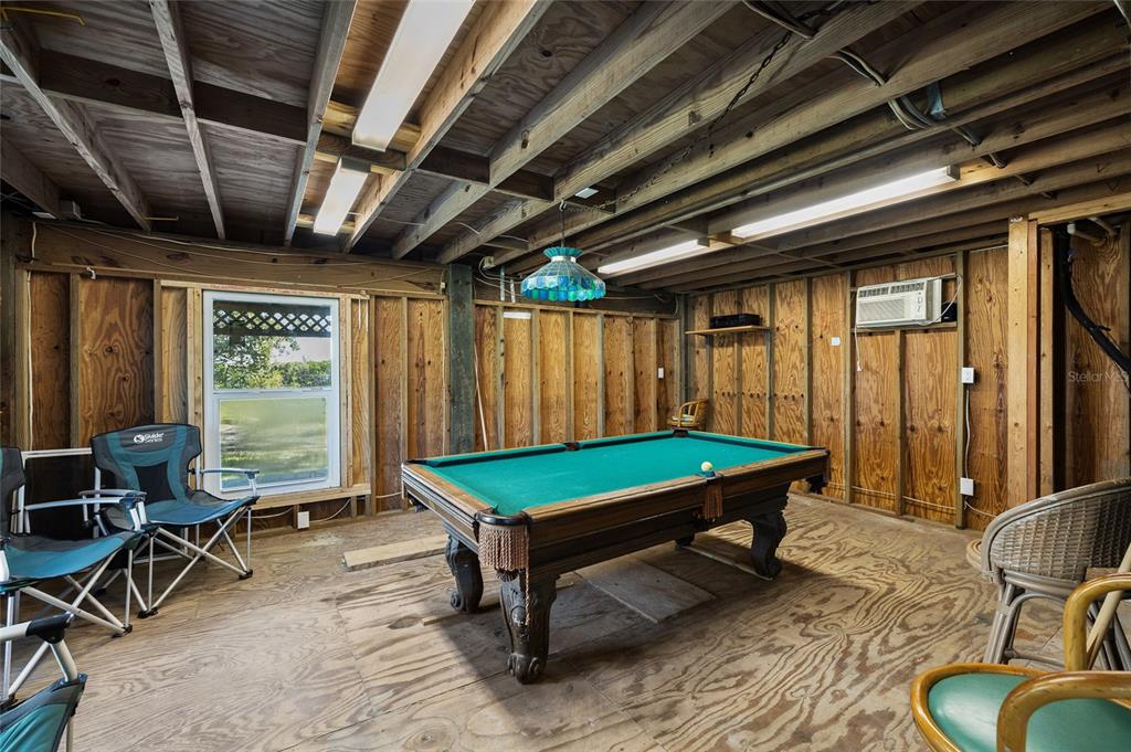 9776 Little Gasparilla Boca Grande, FL 33921 - Photo 42 of 52 a room with furniture pool table table tennis table and a chandelier