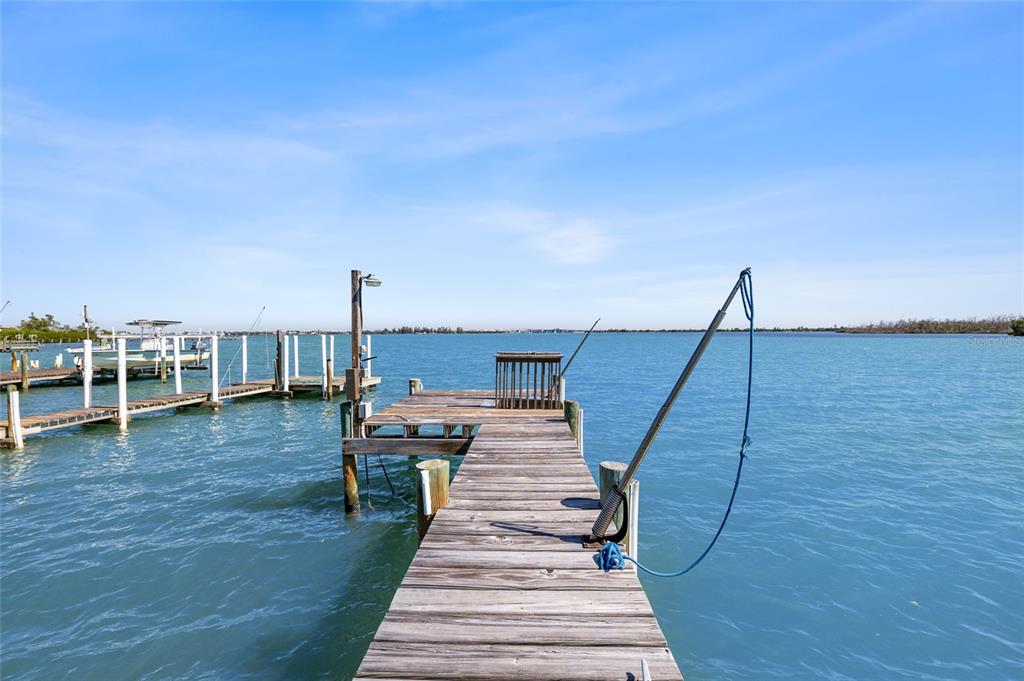 9776 Little Gasparilla Boca Grande, FL 33921 - Photo 5 of 52 a view of a patio with wooden floor