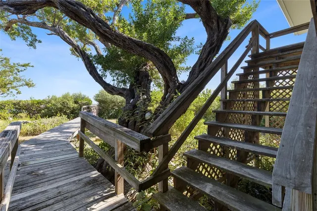 a view of kitchen and dining room with wooden floor