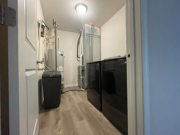 a walk in closet with a mirror