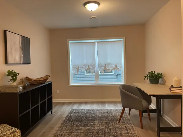 a workspace with furniture and window