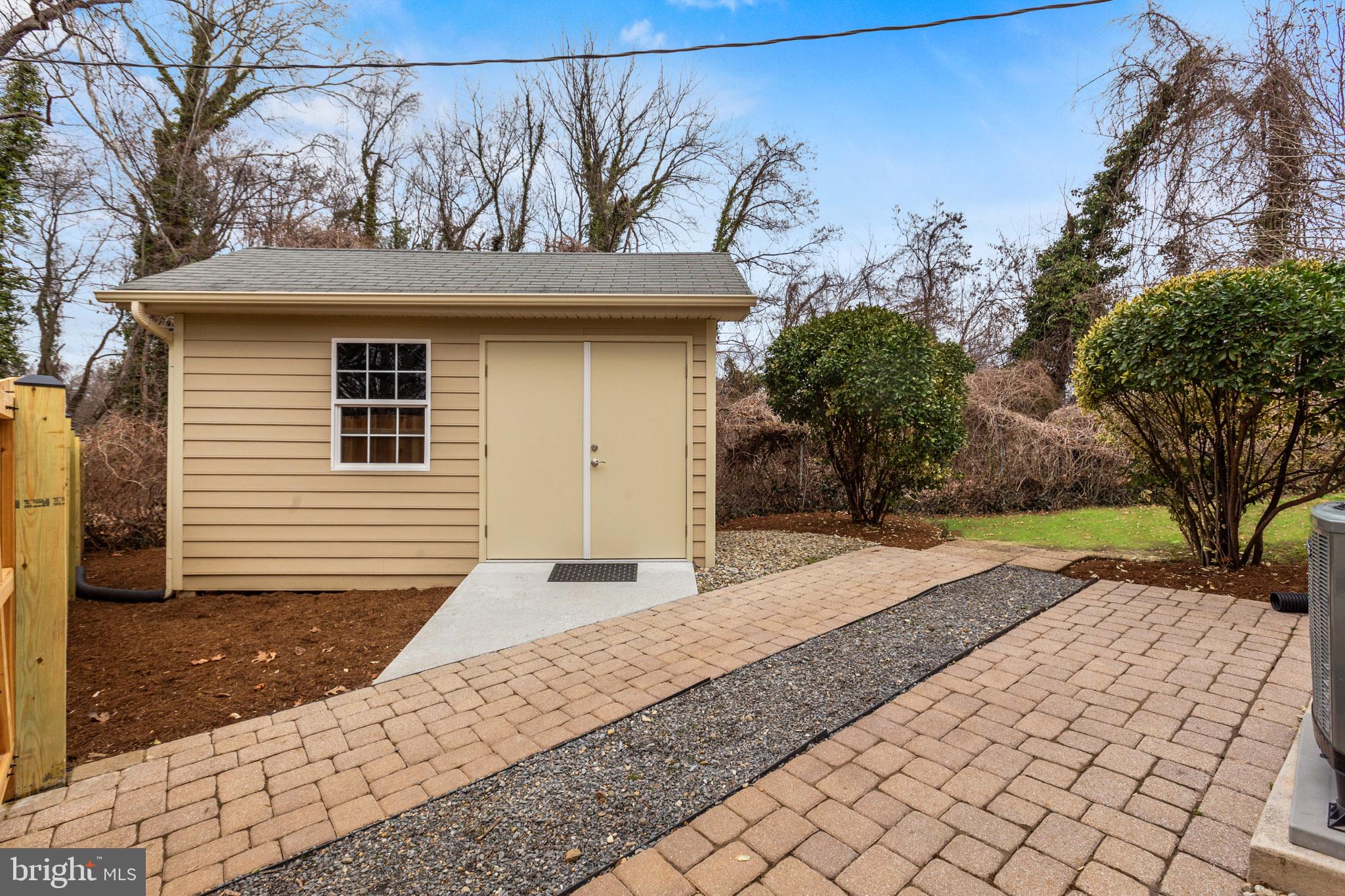 218 Lees Lane Edgewater, MD 21037 - Photo 36 of 41 Charming shed nestled in nature's embrace.
