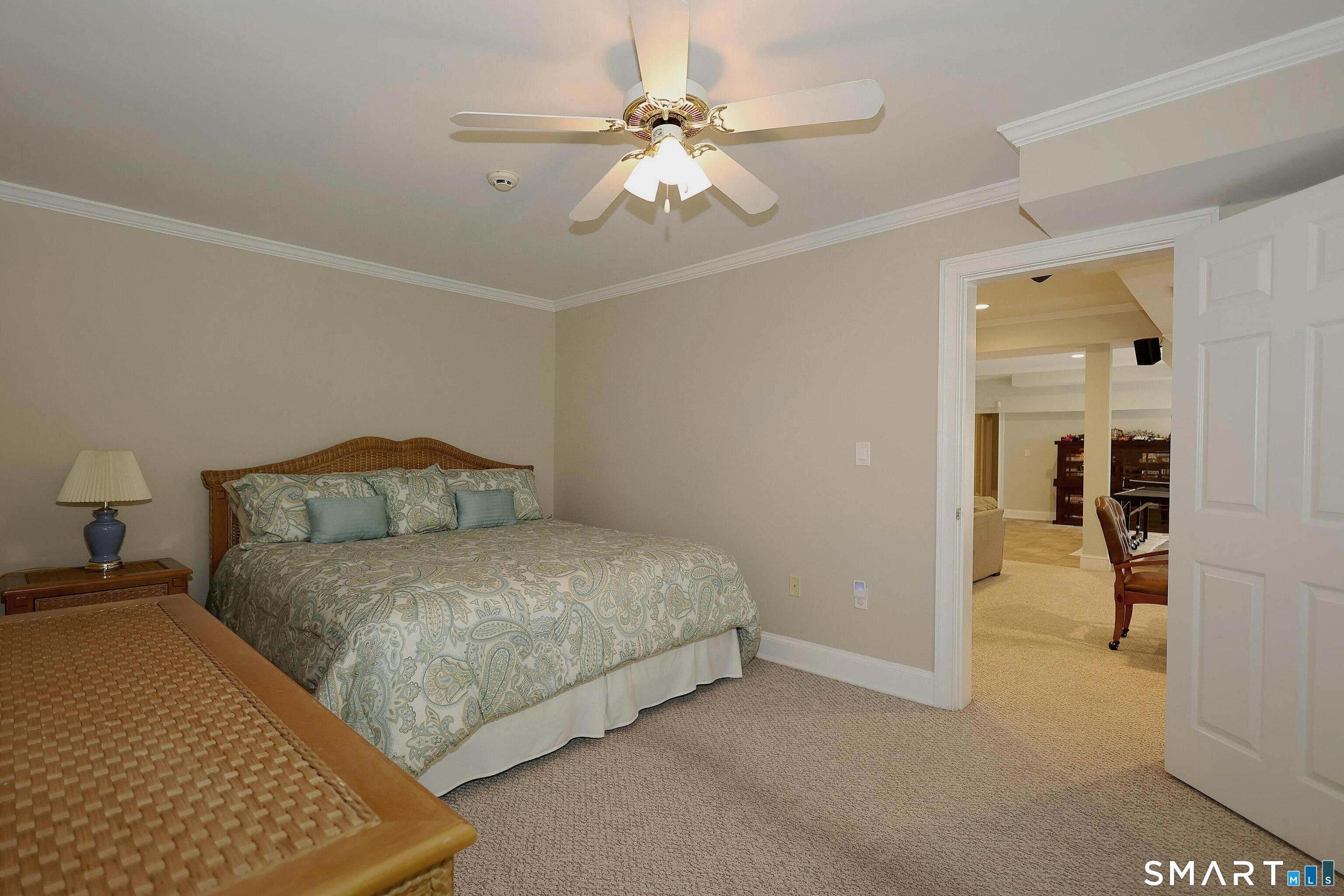 30 Whipstick Road Ridgefield, CT 06877 - Photo 37 of 40 a spacious bedroom with a bed and a chandelier