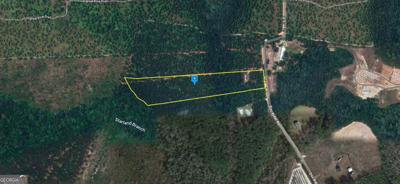 a balcony with lots of green space and garden view