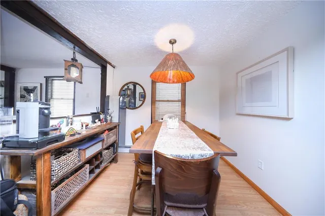 a view of a kitchen with a sink and a stove top oven