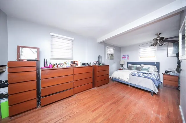 a living room with furniture and flat screen tv